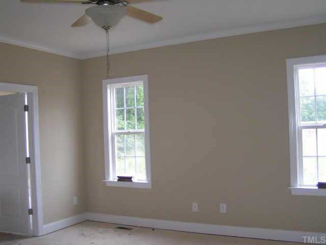 2458 Rolling Tracks Road Willow Spring, NC 27592 - Photo 6 of 10 Master bedroom