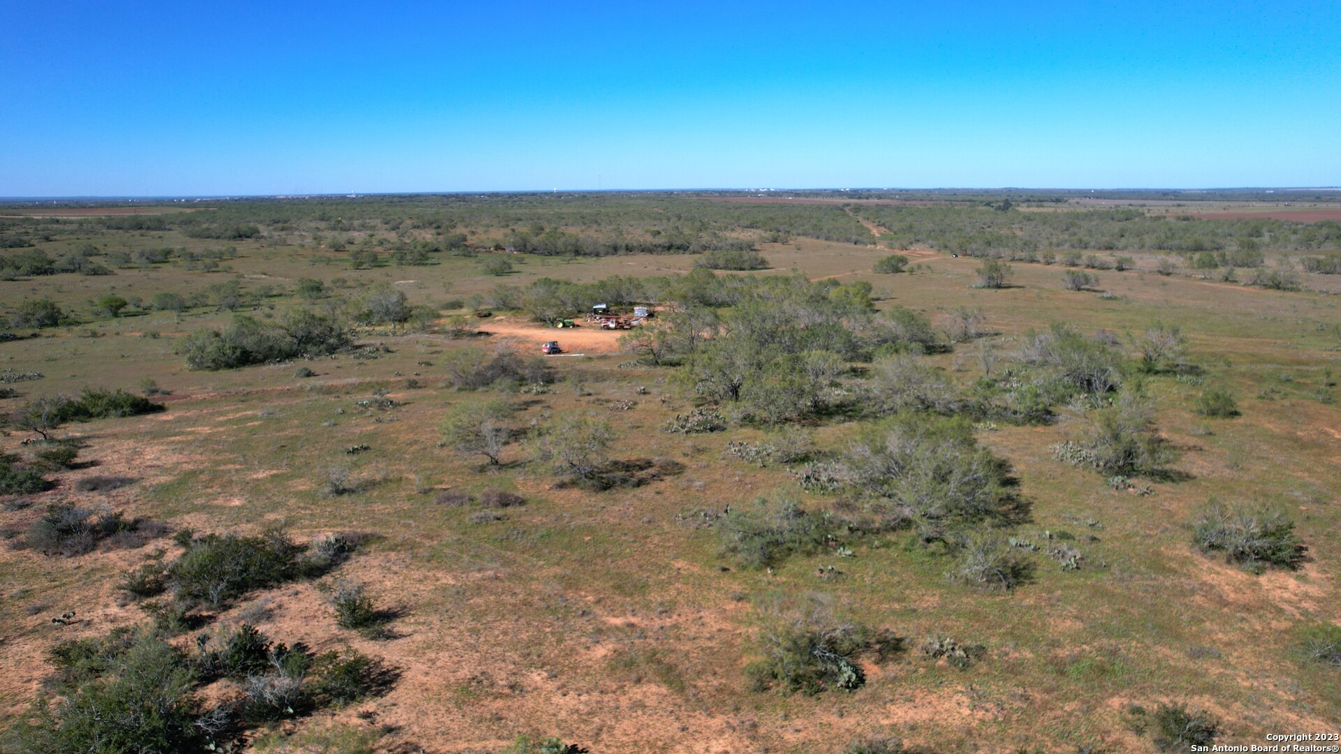 1913 County Road 3000 Pearsall, TX 78061 - Photo 14 of 38 a view of a dry yard with lots of trees