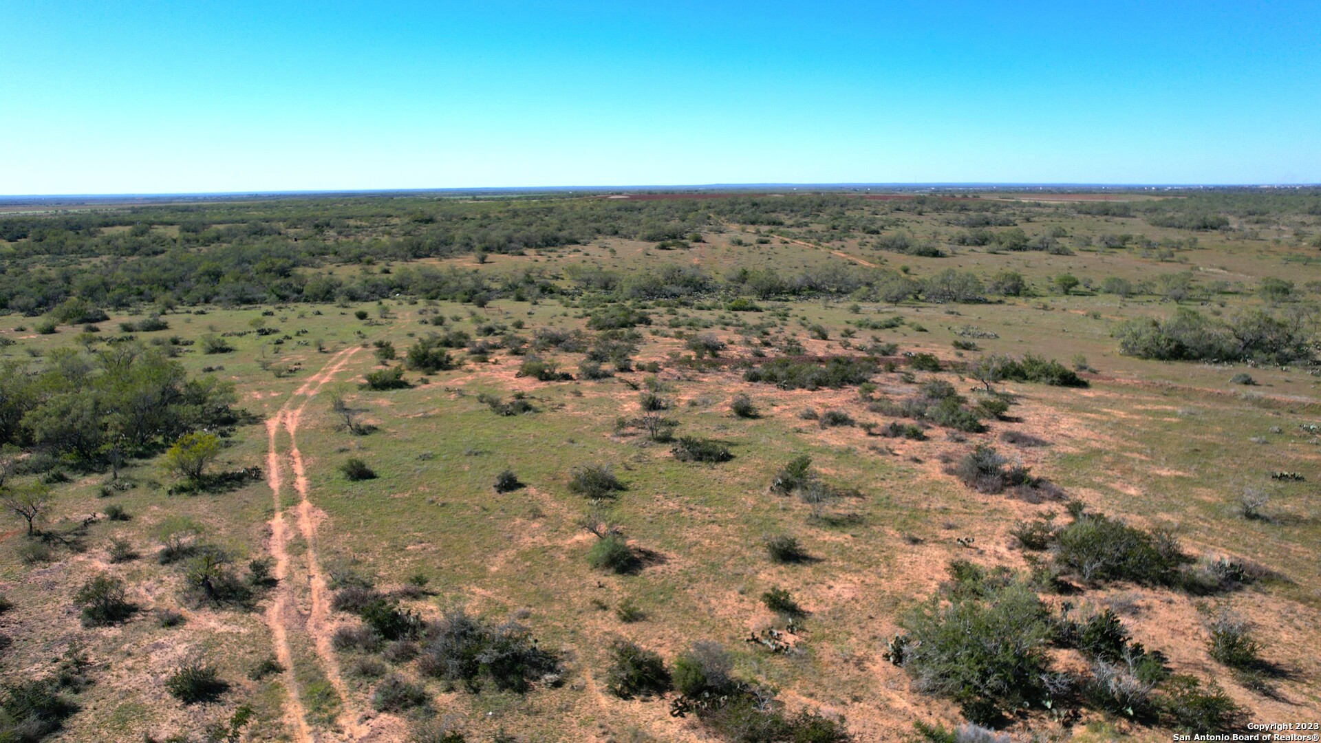 1913 County Road 3000 Pearsall, TX 78061 - Photo 15 of 38 an aerial view of a houses with a yard