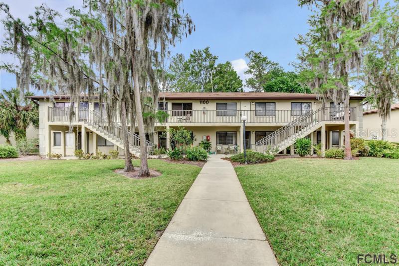 1601 Big Tree Road, Unit 1103 South Daytona, FL 32119 - Photo 1 of 1 front view of a house with a yard
