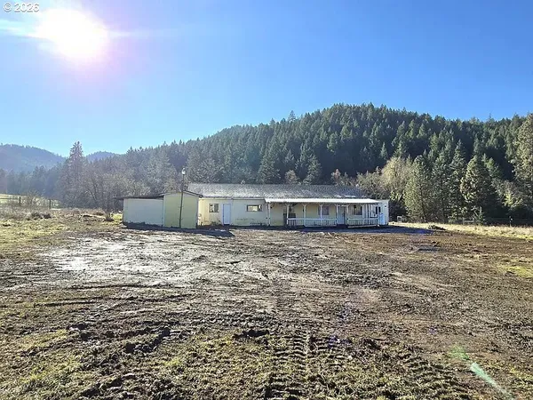 a view of a tiny house with a mountain