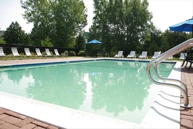 a view of a swimming pool with a patio