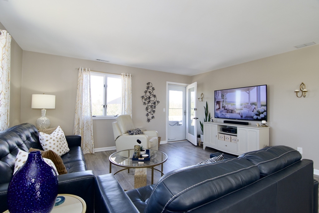 2205 Boston Road, Unit Q160 Wilbraham, MA 01095 - Photo 17 of 41 a living room with furniture and a flat screen tv