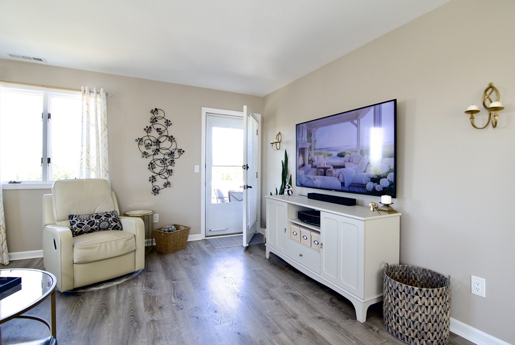 2205 Boston Road, Unit Q160 Wilbraham, MA 01095 - Photo 18 of 41 a living room with furniture and a flat screen tv