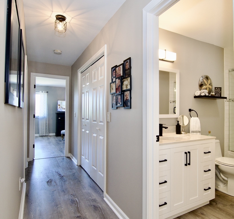 2205 Boston Road, Unit Q160 Wilbraham, MA 01095 - Photo 19 of 41 a view of a hallway with wooden floor and closet