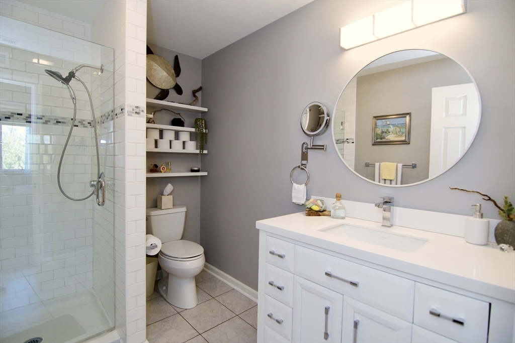 2205 Boston Road, Unit Q160 Wilbraham, MA 01095 - Photo 22 of 41 a bathroom with a sink a toilet and a mirror