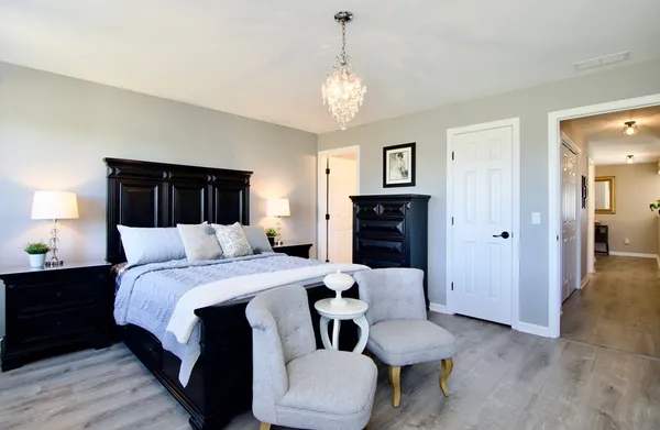 a bedroom with a bed and a dresser