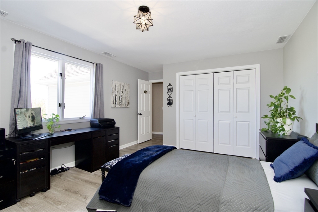 2205 Boston Road, Unit Q160 Wilbraham, MA 01095 - Photo 27 of 41 a bedroom with a bed and a potted plant