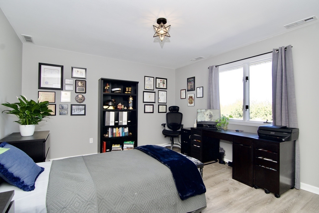 2205 Boston Road, Unit Q160 Wilbraham, MA 01095 - Photo 28 of 41 a bedroom with a bed dresser and a window