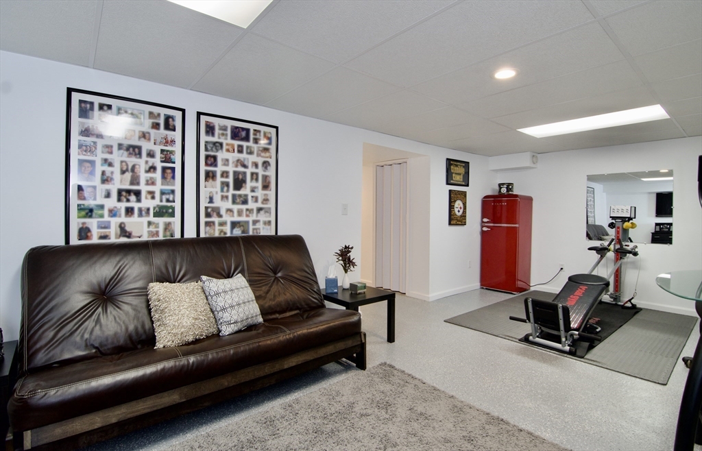 2205 Boston Road, Unit Q160 Wilbraham, MA 01095 - Photo 33 of 41 a living room with furniture a flat screen tv and a window