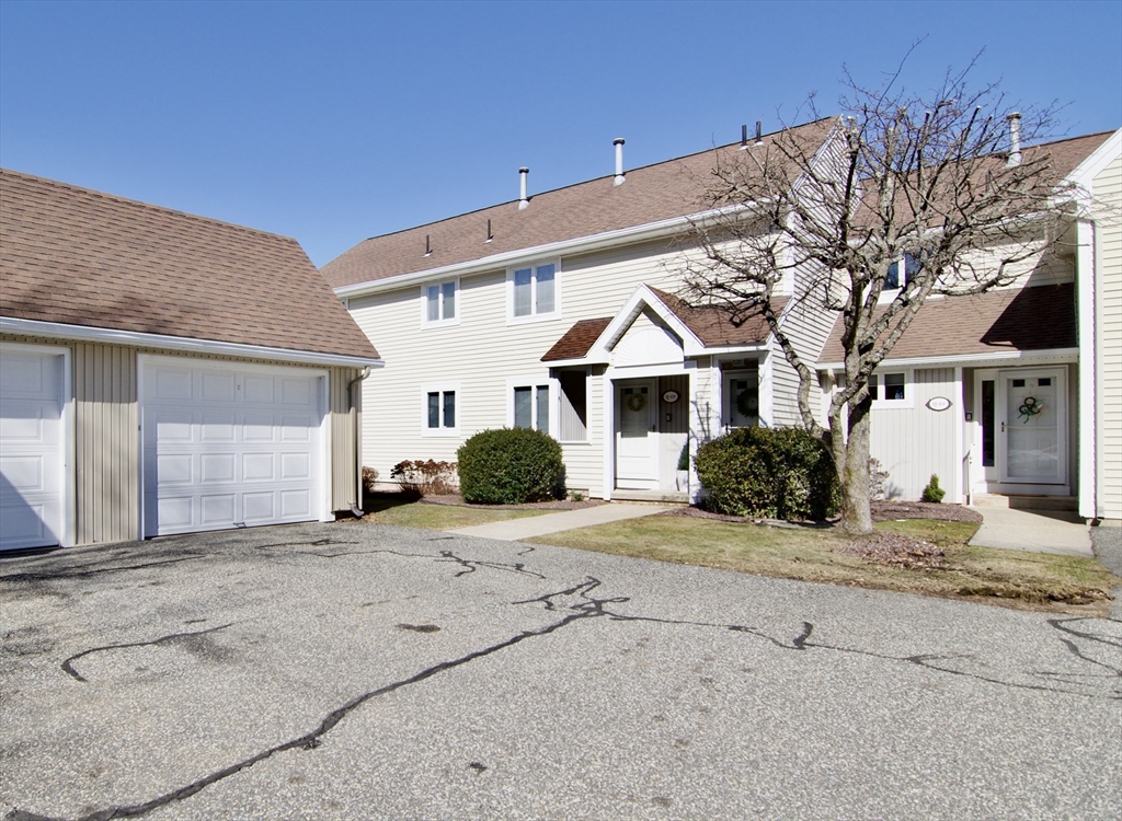 2205 Boston Road, Unit Q160 Wilbraham, MA 01095 - Photo 38 of 41 a view of a white house with a large tree and yard