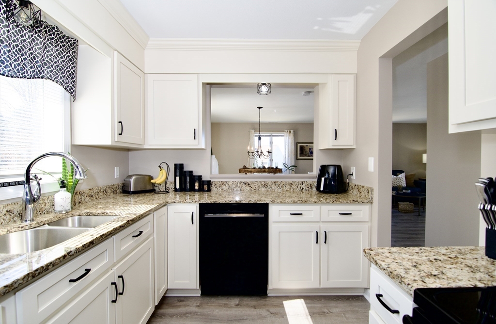 2205 Boston Road, Unit Q160 Wilbraham, MA 01095 - Photo 8 of 41 a kitchen with stainless steel appliances granite countertop a sink stove and cabinets