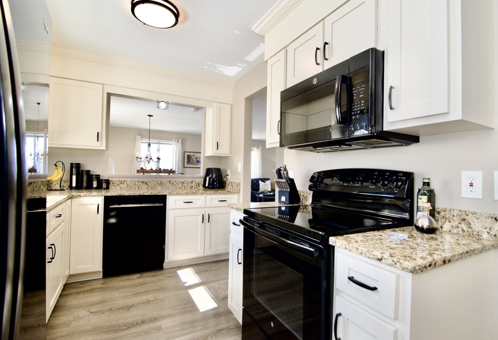 2205 Boston Road, Unit Q160 Wilbraham, MA 01095 - Photo 9 of 41 a kitchen with a stove microwave and sink