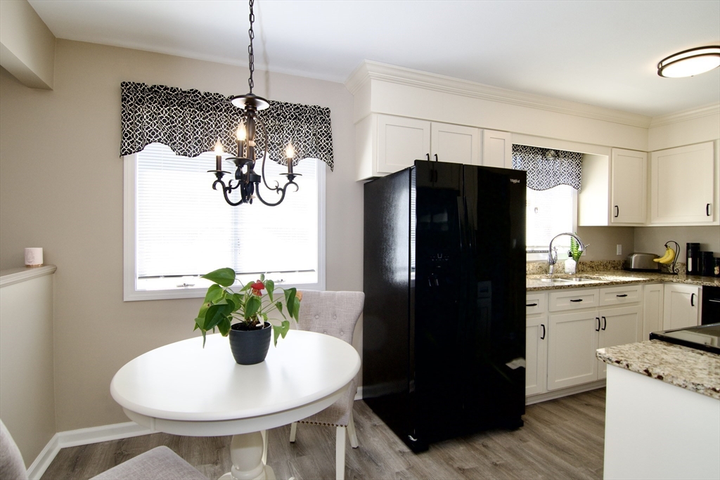 2205 Boston Road, Unit Q160 Wilbraham, MA 01095 - Photo 10 of 41 a kitchen with stainless steel appliances granite countertop a refrigerator a stove a sink and a dining table