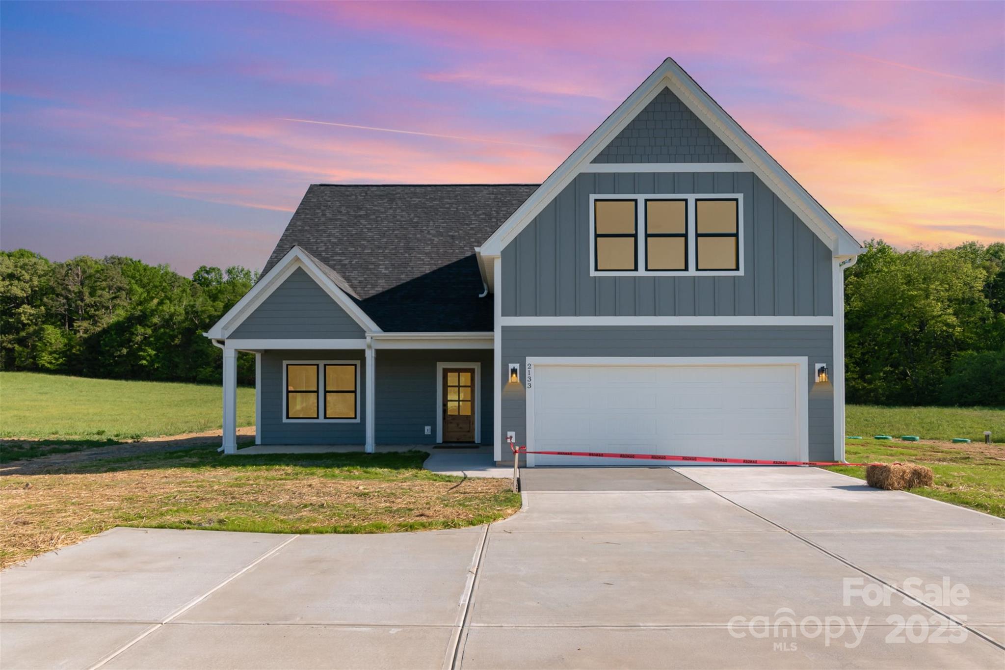 2133 Tite Road Stanfield, NC 28163 - Photo 4 of 35 a front view of a house with a yard and garage