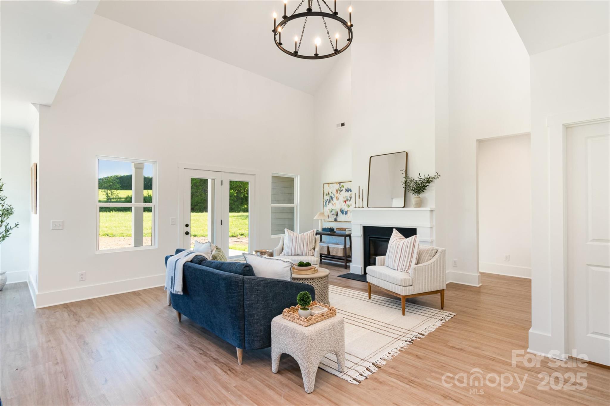2133 Tite Road Stanfield, NC 28163 - Photo 7 of 35 a living room with furniture a fireplace and a table