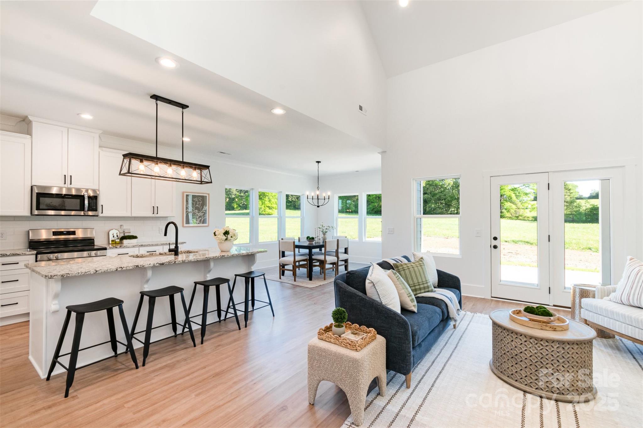 2133 Tite Road Stanfield, NC 28163 - Photo 9 of 35 a living room with furniture dining table and a large window
