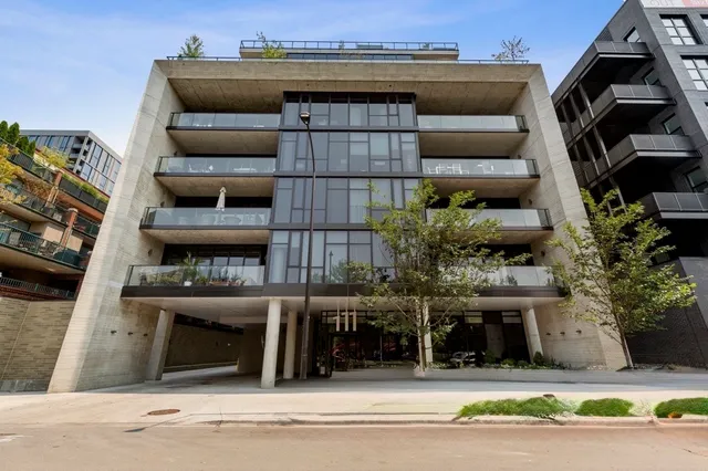 a view of a building and car parked