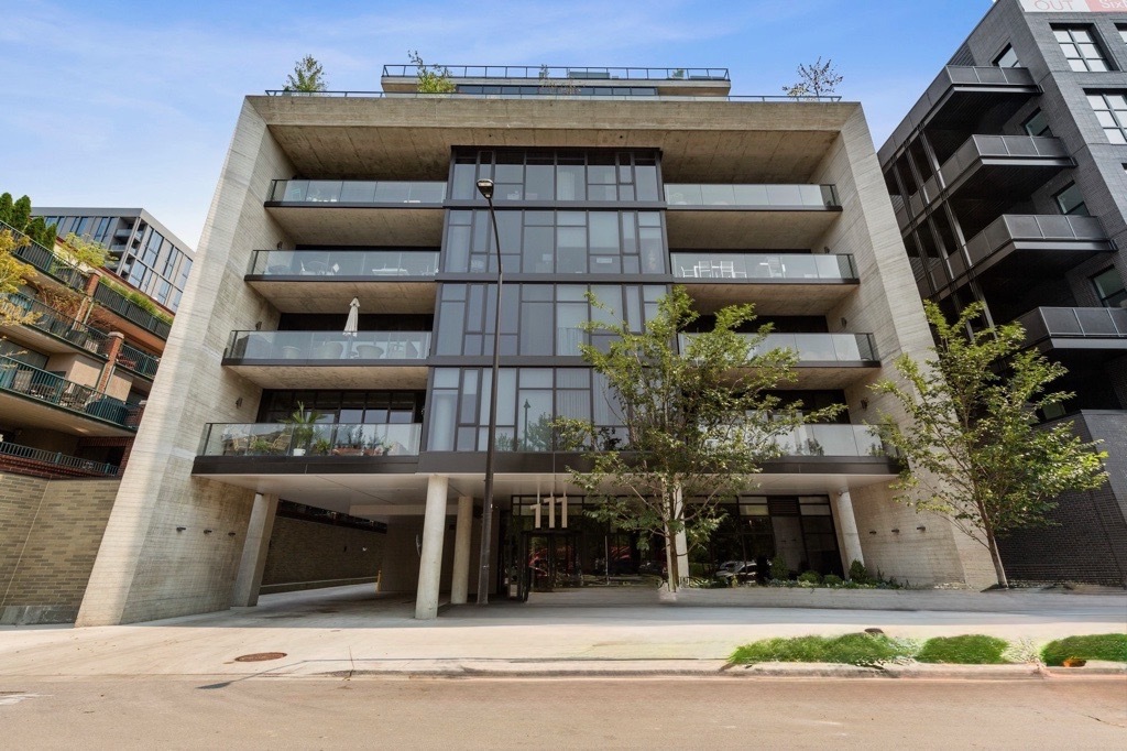 a view of a building and car parked