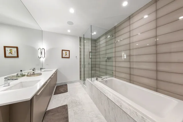 a bathroom with a bathtub and a sink