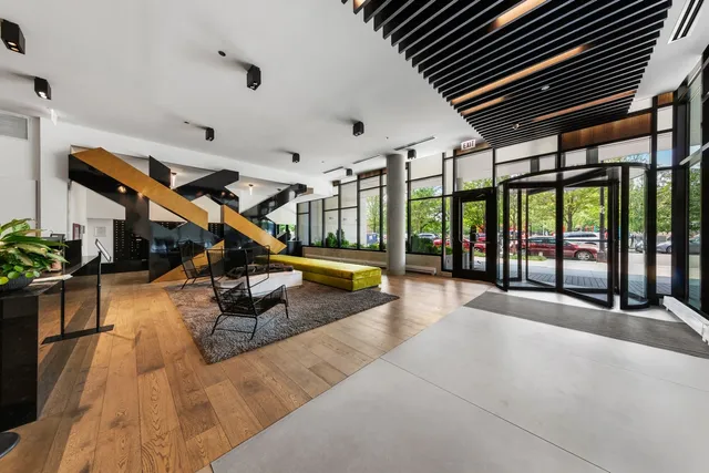 a swimming pool with outdoor seating and hardwood floor