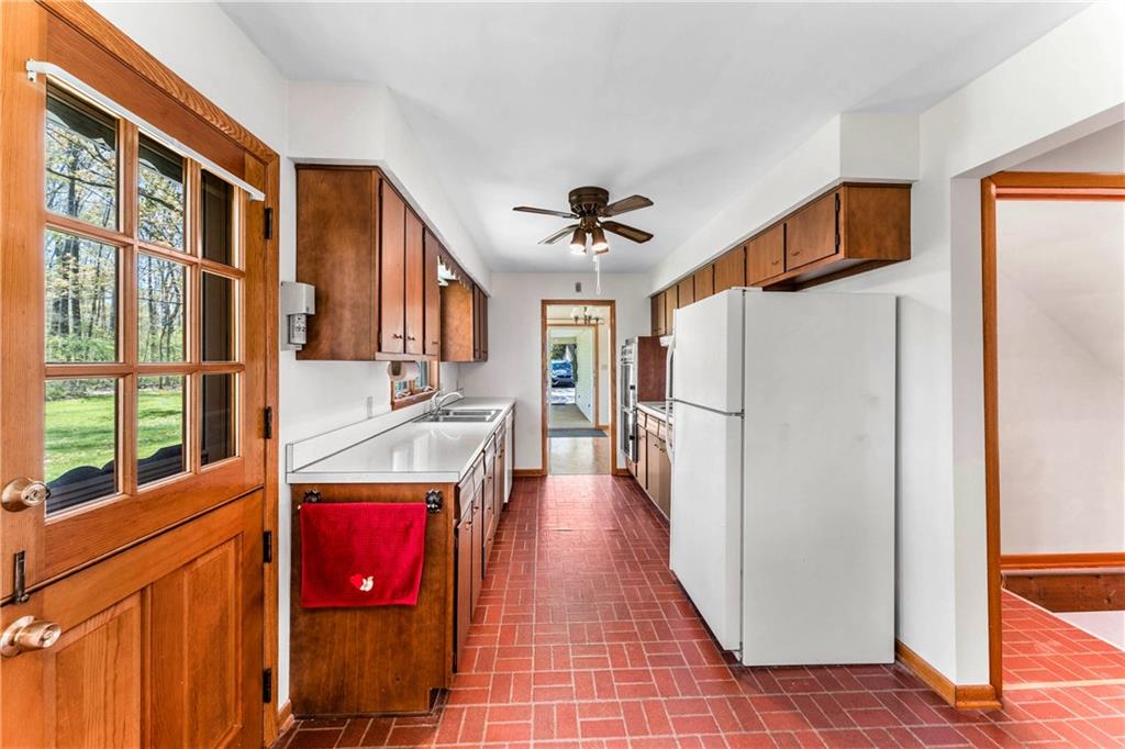 200 Maple Grove Road West Middlesex, PA 16159 - Photo 13 of 25 a view of a kitchen with stainless steel appliances a refrigerator and a stove