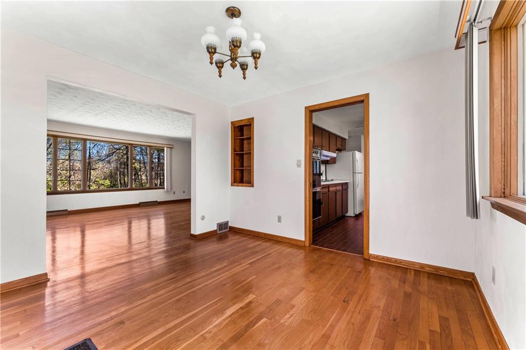 200 Maple Grove Road West Middlesex, PA 16159 - Photo 8 of 25 wooden floor in an empty room with a window