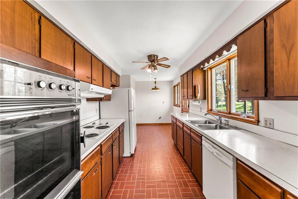 200 Maple Grove Road West Middlesex, PA 16159 - Photo 9 of 25 a kitchen with stainless steel appliances a sink stove and cabinets
