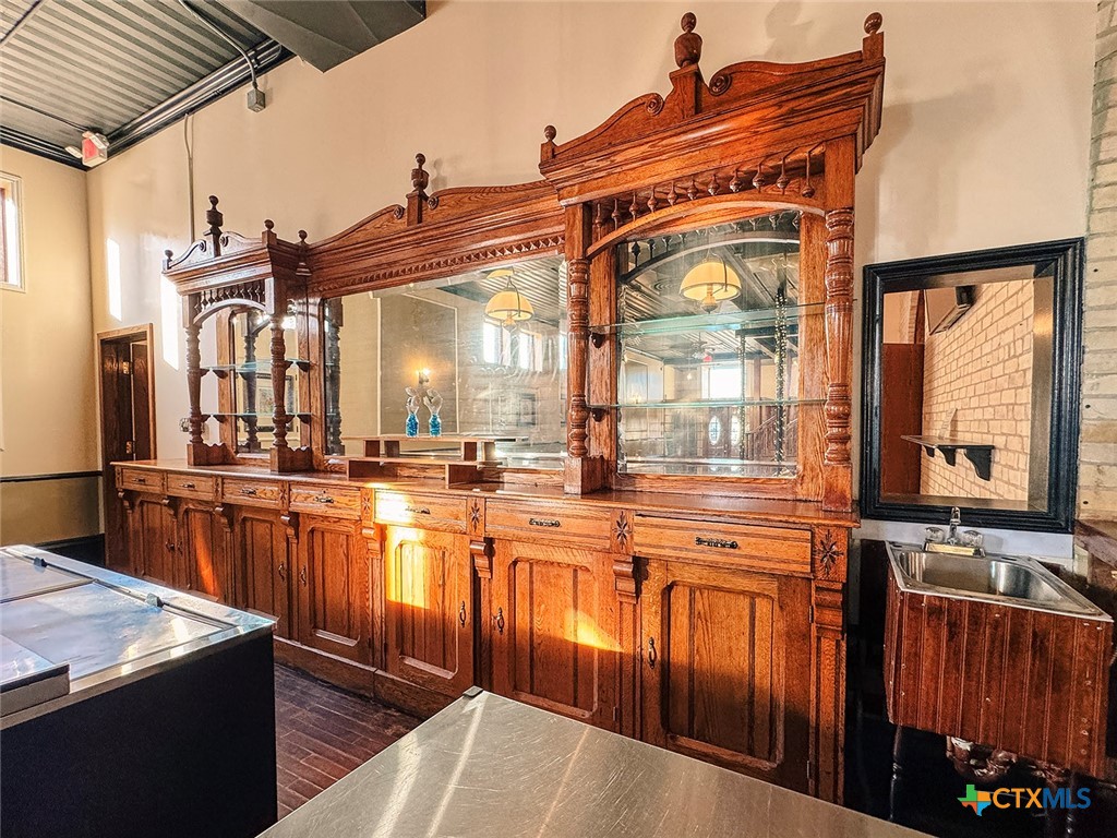 202 East Forrest Street Victoria, TX 77901 - Photo 11 of 47 a bathroom with a sink a mirror and next to a window