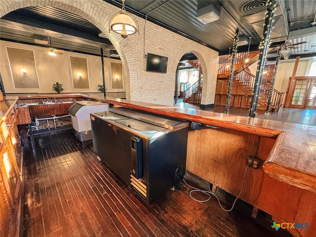 202 East Forrest Street Victoria, TX 77901 - Photo 12 of 47 a kitchen with stainless steel appliances granite countertop a stove and a wooden floors