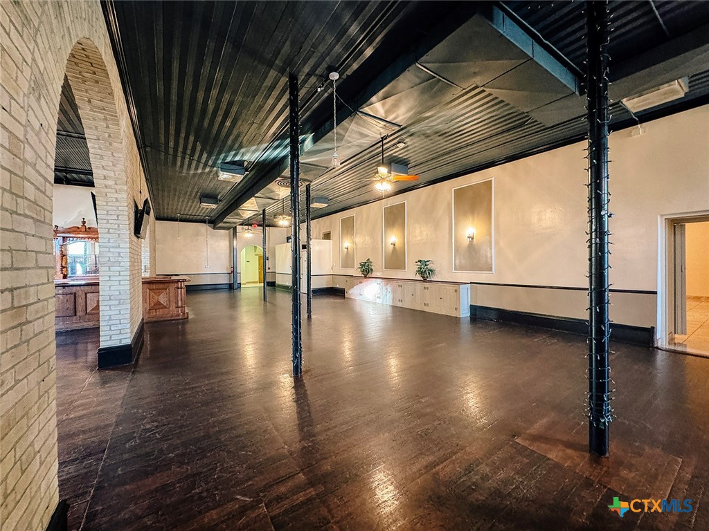 202 East Forrest Street Victoria, TX 77901 - Photo 15 of 47 a view of an empty room with wooden floor
