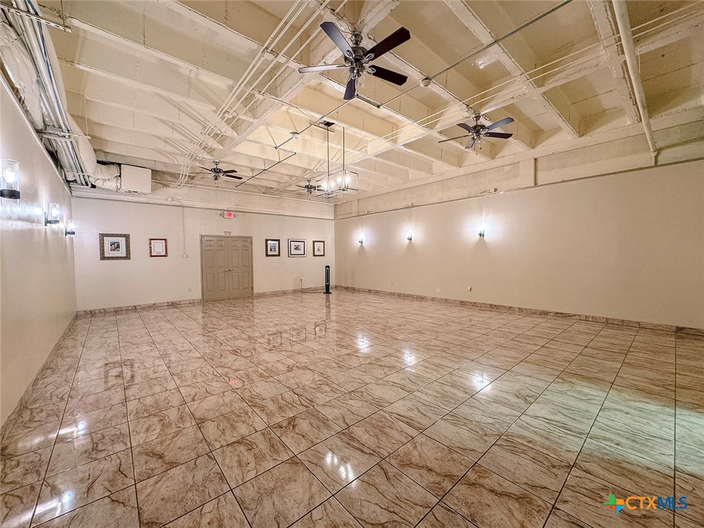 202 East Forrest Street Victoria, TX 77901 - Photo 18 of 47 a view of a room with lots of racks on the wall