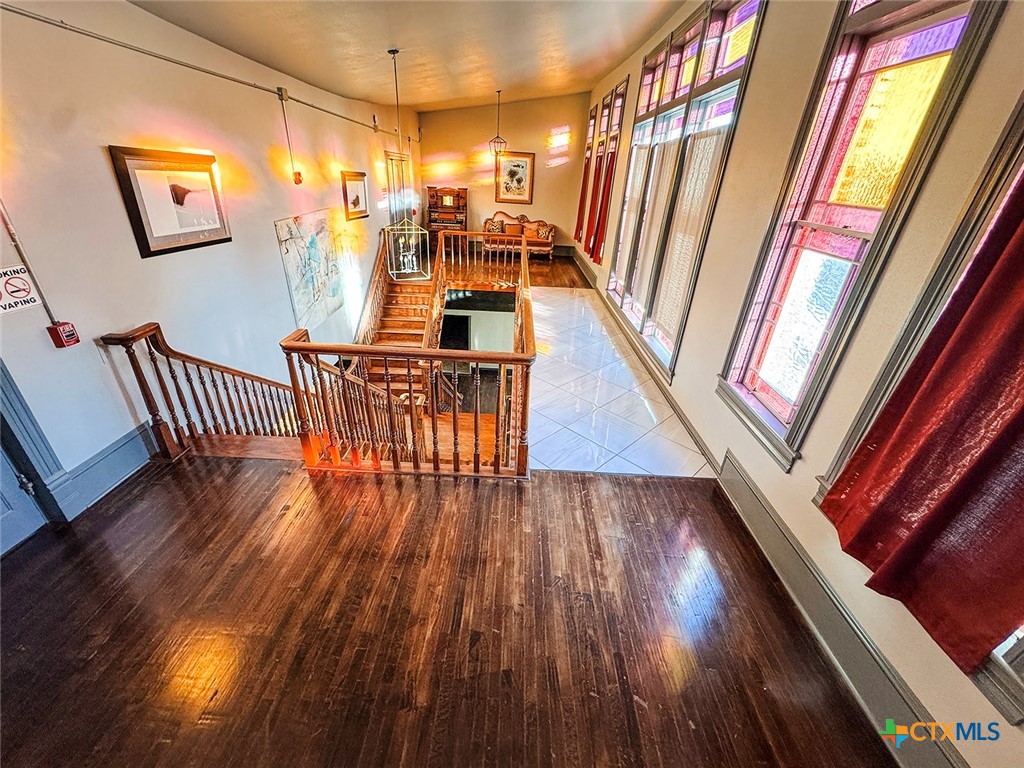 202 East Forrest Street Victoria, TX 77901 - Photo 34 of 47 a view of balcony with furniture and wooden floor