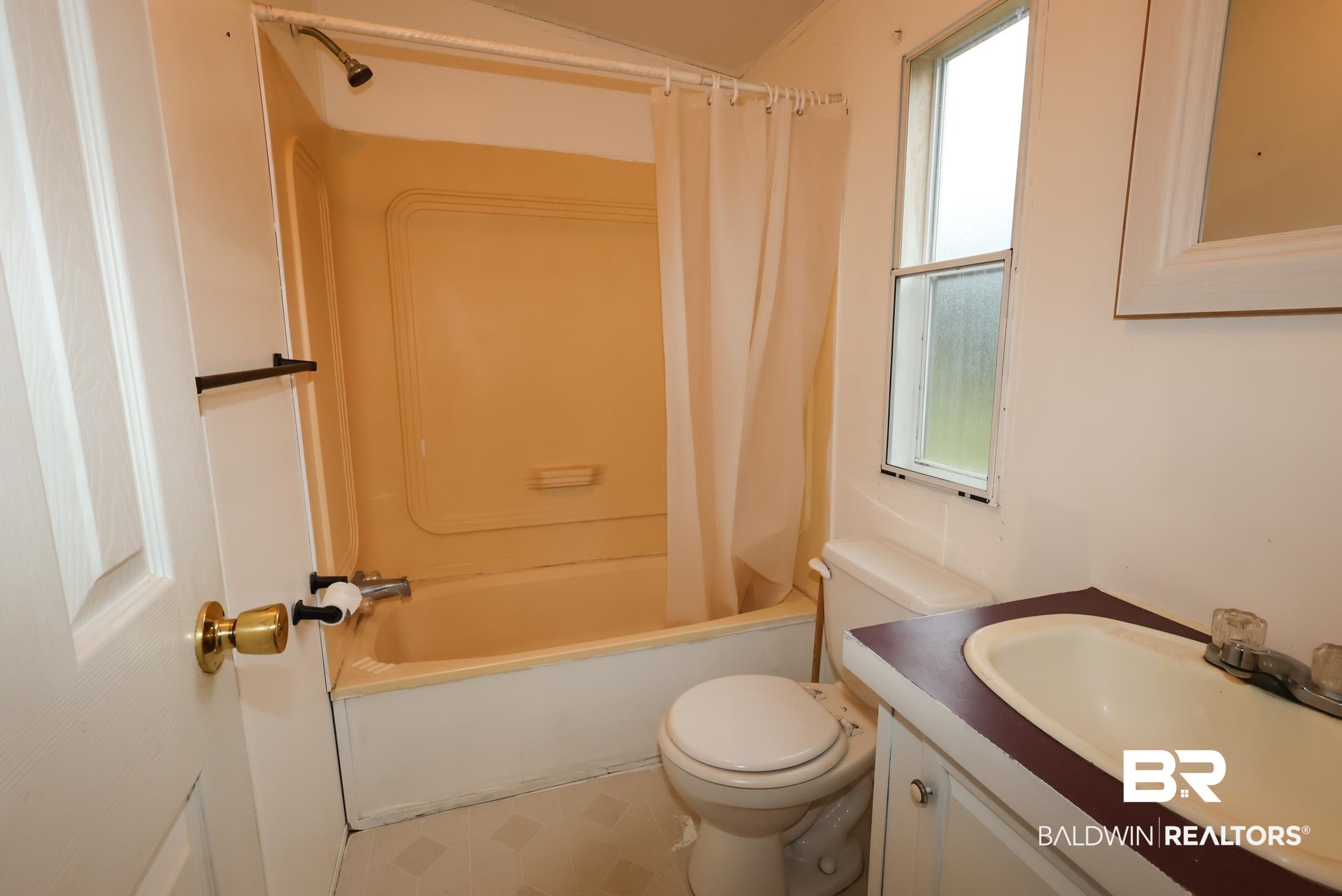 588 A D Clark Road Castleberry, AL 36432 - Photo 11 of 17 Full bathroom with shower / tub combo with curtain and vanity