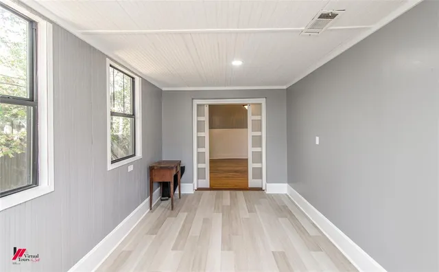 a bathroom with a sink vanity and mirror