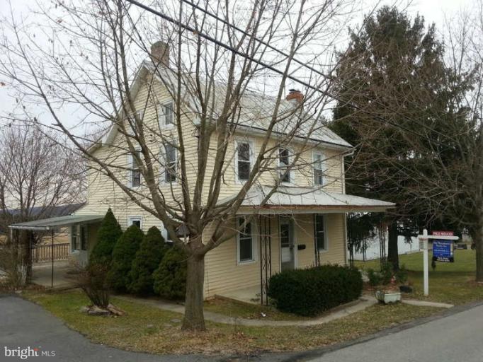 3525 Young Road Manchester, MD 21102 - Photo 1 of 26 a front view of a house with garden