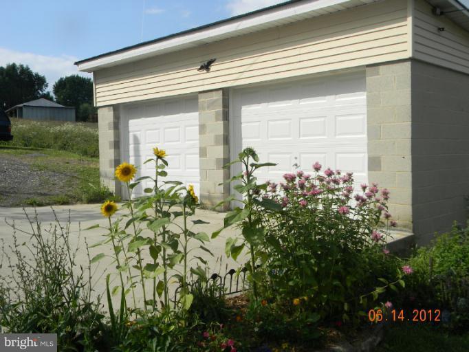 3525 Young Road Manchester, MD 21102 - Photo 2 of 26 a front view of a house with a yard