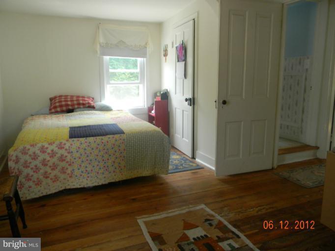 3525 Young Road Manchester, MD 21102 - Photo 13 of 26 a bedroom with a bed and a window