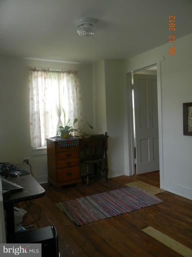 3525 Young Road Manchester, MD 21102 - Photo 14 of 26 a bed room with a bed and a window
