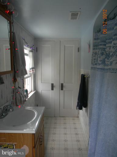 3525 Young Road Manchester, MD 21102 - Photo 9 of 26 a bathroom with a sink and a mirror