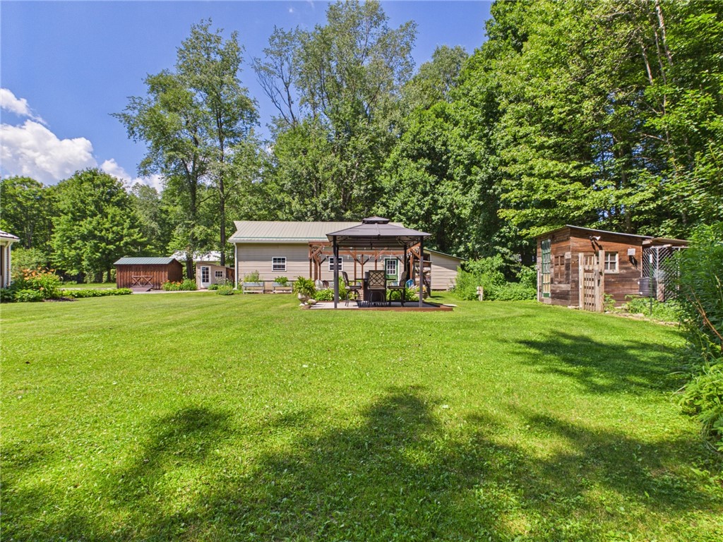 87 Collins Road Lewis Run, PA 16738 - Photo 33 of 48 Side/back yard with entertainment space and outbui