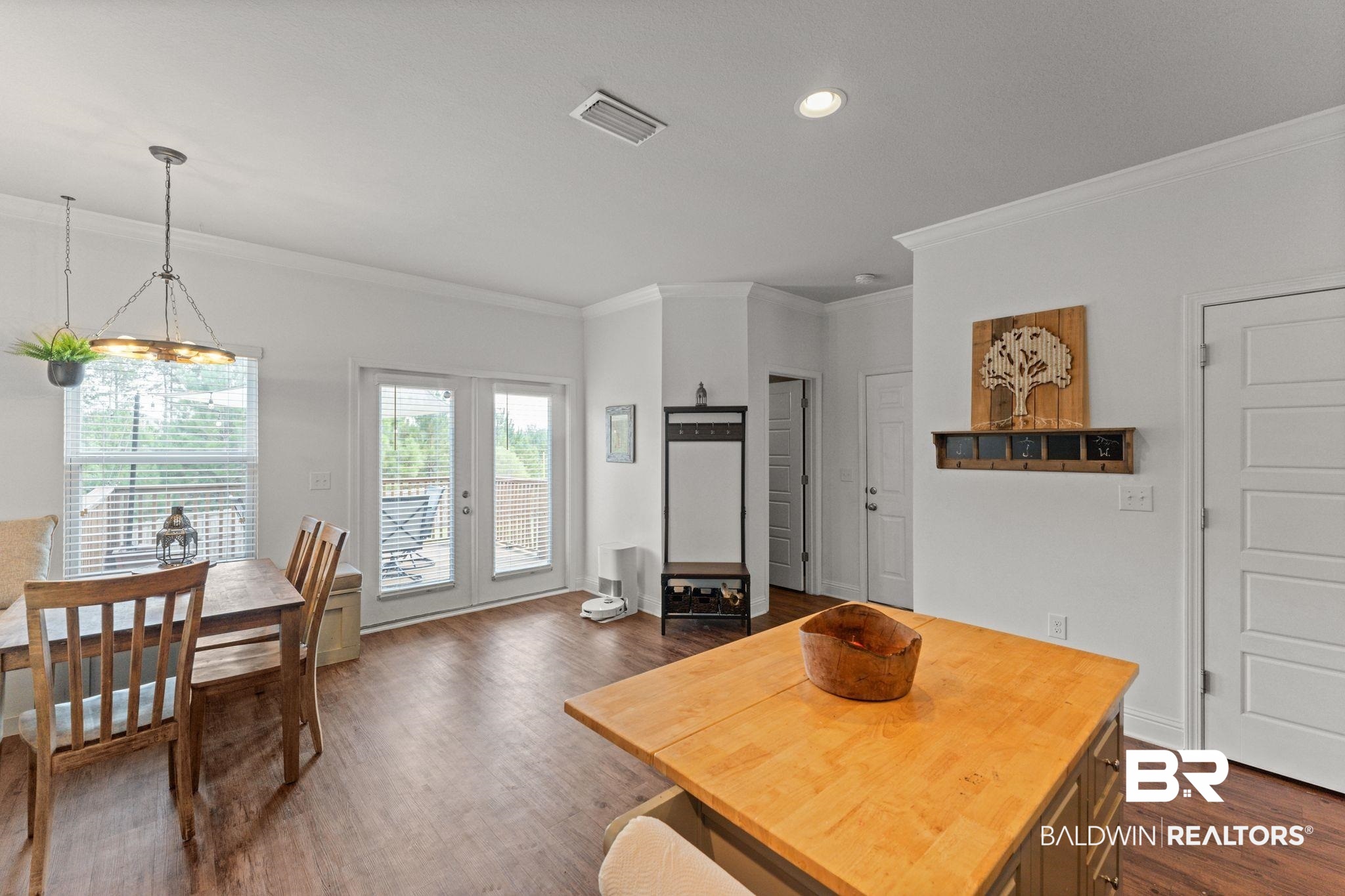 12711 Chickadee Lane Daphne, AL 36527 - Photo 15 of 39 Dining space featuring ornamental molding, dark wood-style flooring, and recessed lighting