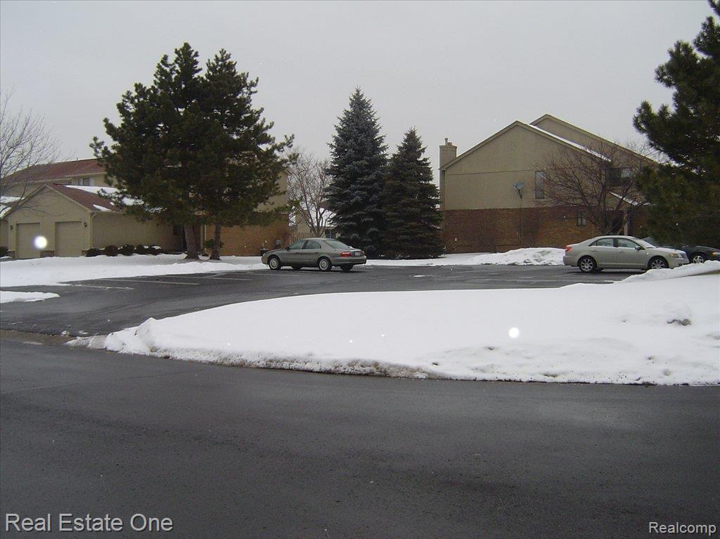 658 Tennyson, Unit 27 Rochester, MI 48307 - Photo 15 of 22 guest parking out front of unit
