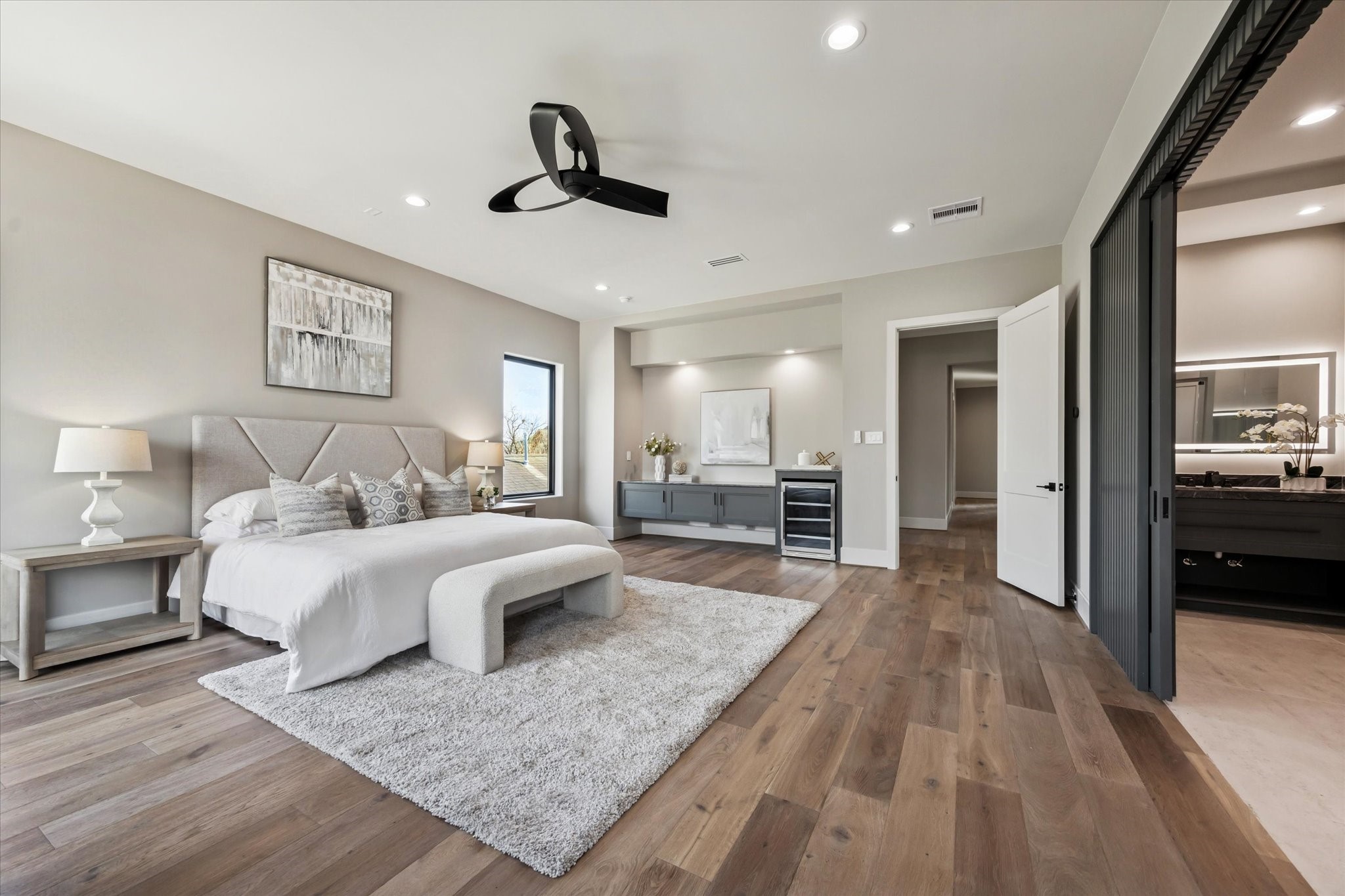 2120 Branard Street Houston, TX 77098 - Photo 16 of 33 a spacious bedroom with a large bed and ceiling fan