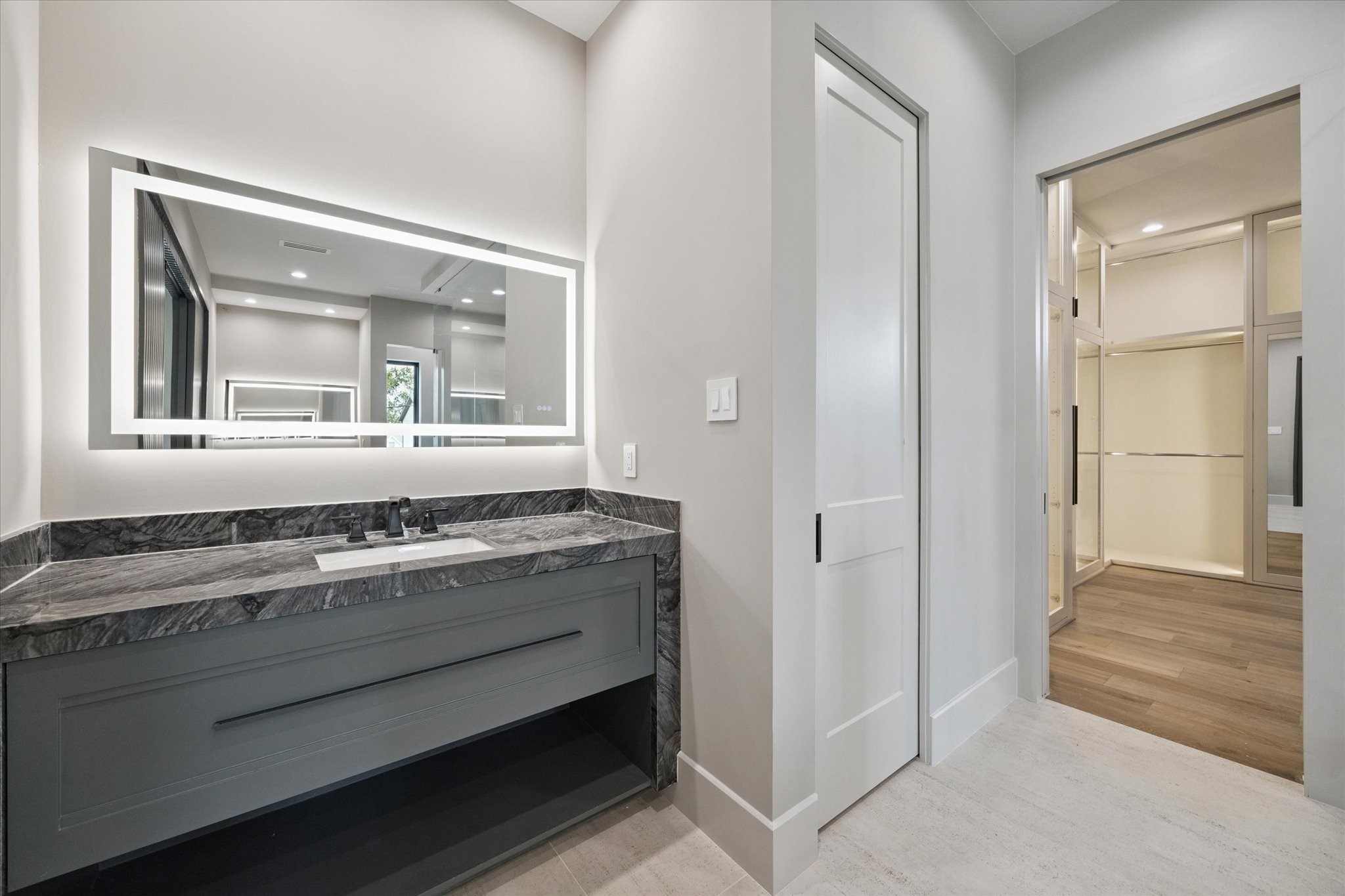 2120 Branard Street Houston, TX 77098 - Photo 19 of 33 a bathroom with a granite countertop sink and a mirror