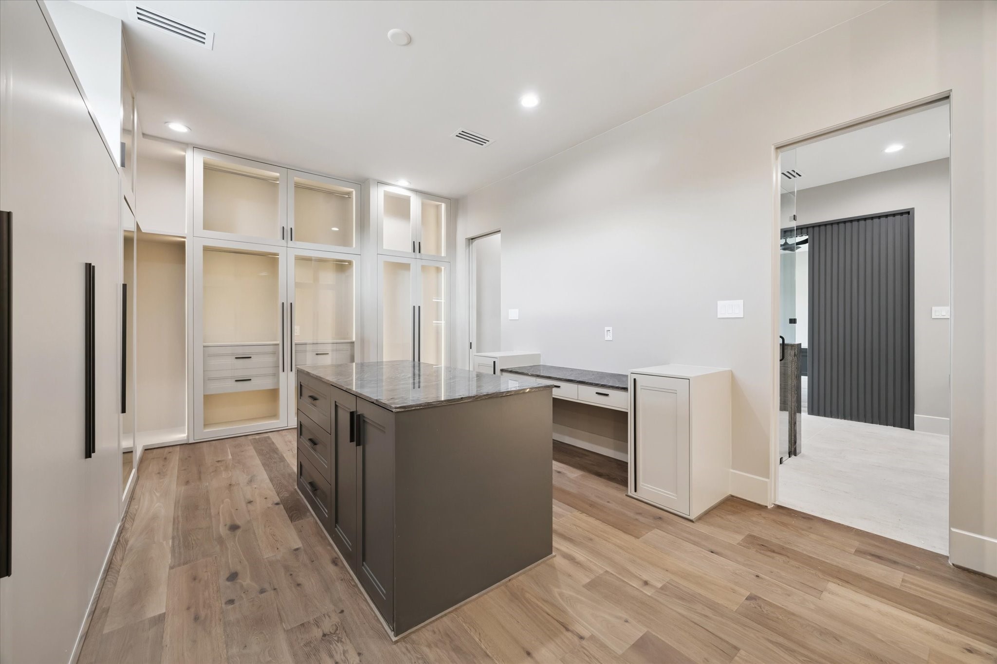 2120 Branard Street Houston, TX 77098 - Photo 20 of 33 a view of a kitchen with wooden floor and electronic appliances