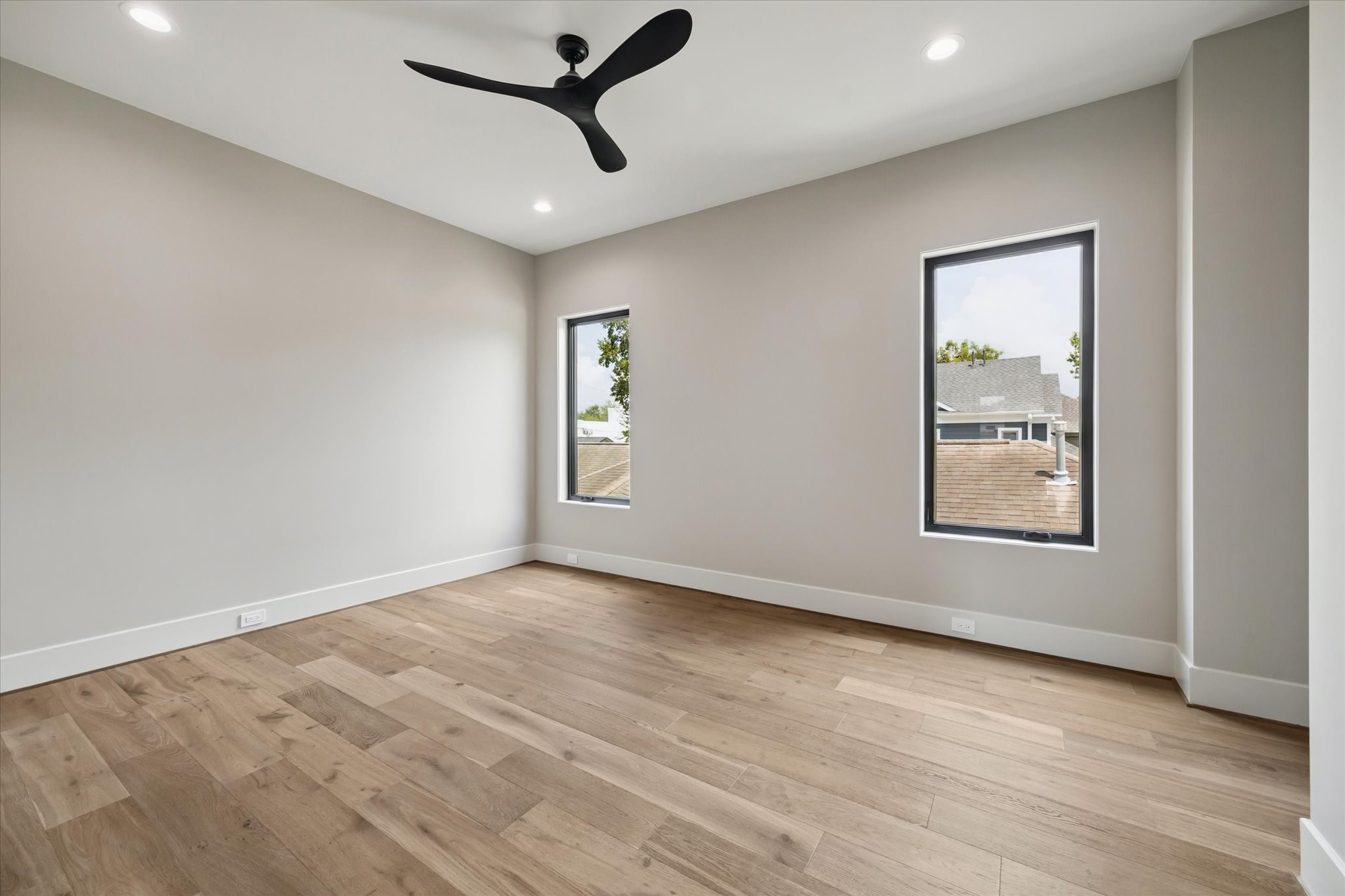 2120 Branard Street Houston, TX 77098 - Photo 22 of 33 a view of an empty room with a window and wooden floor