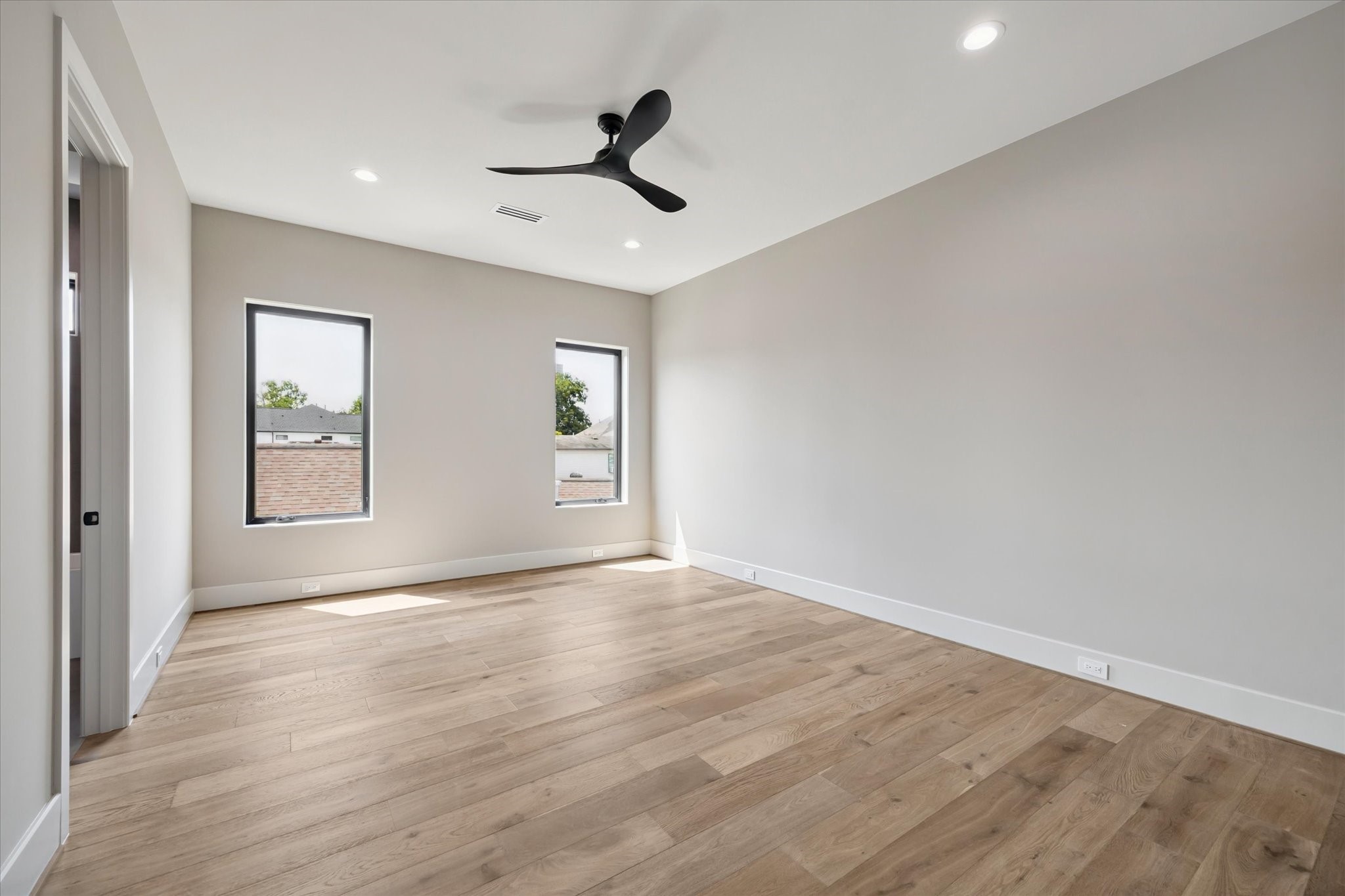 2120 Branard Street Houston, TX 77098 - Photo 24 of 33 a view of an empty room with window and wooden floor