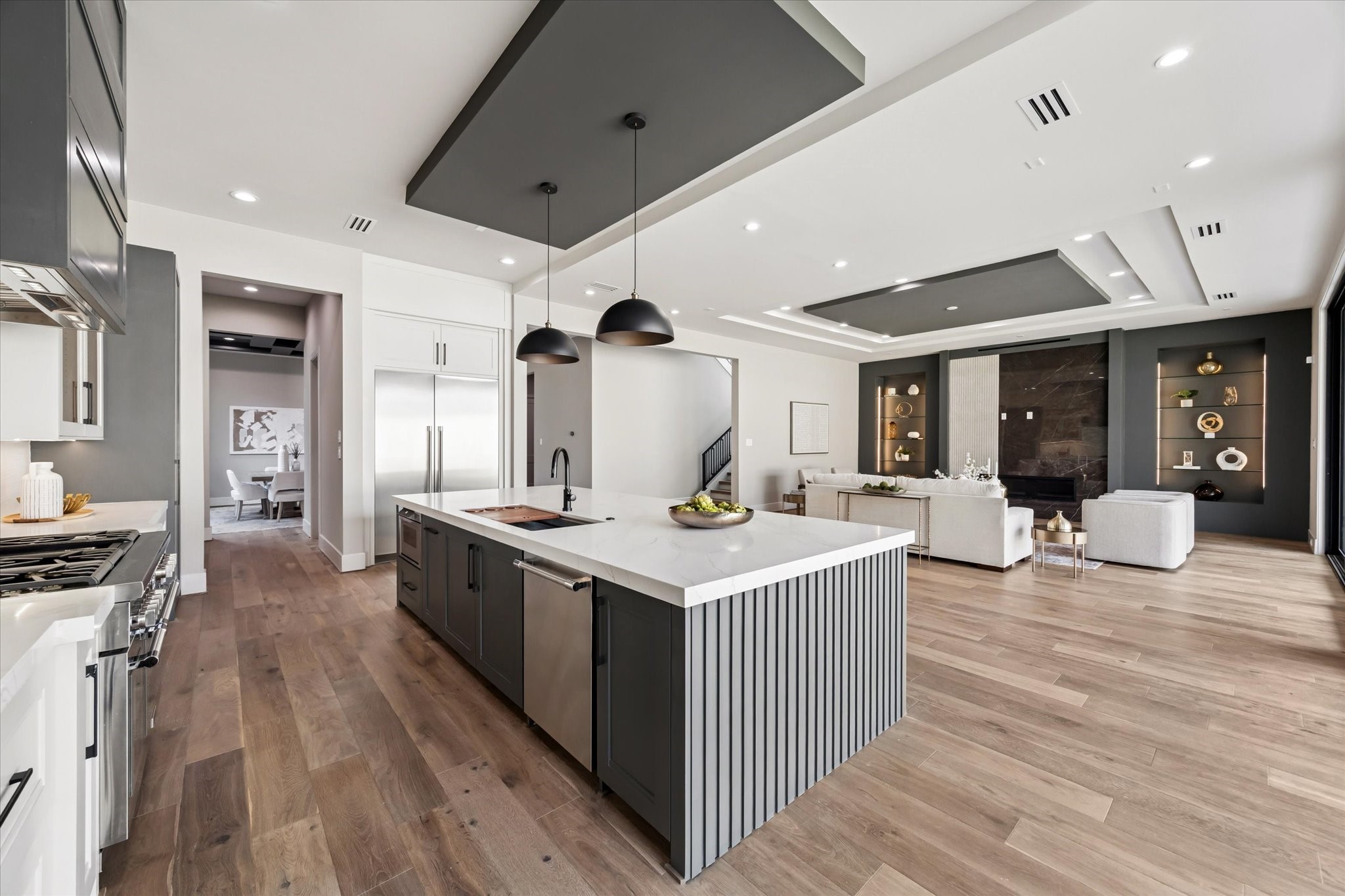 2120 Branard Street Houston, TX 77098 - Photo 10 of 33 a kitchen with stainless steel appliances a stove and a wooden floor