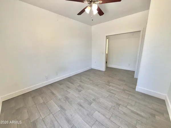 a spacious bathroom with a double vanity sink toilet and shower